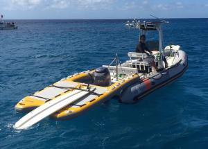 Inflatable boat sled adding space to a small boat